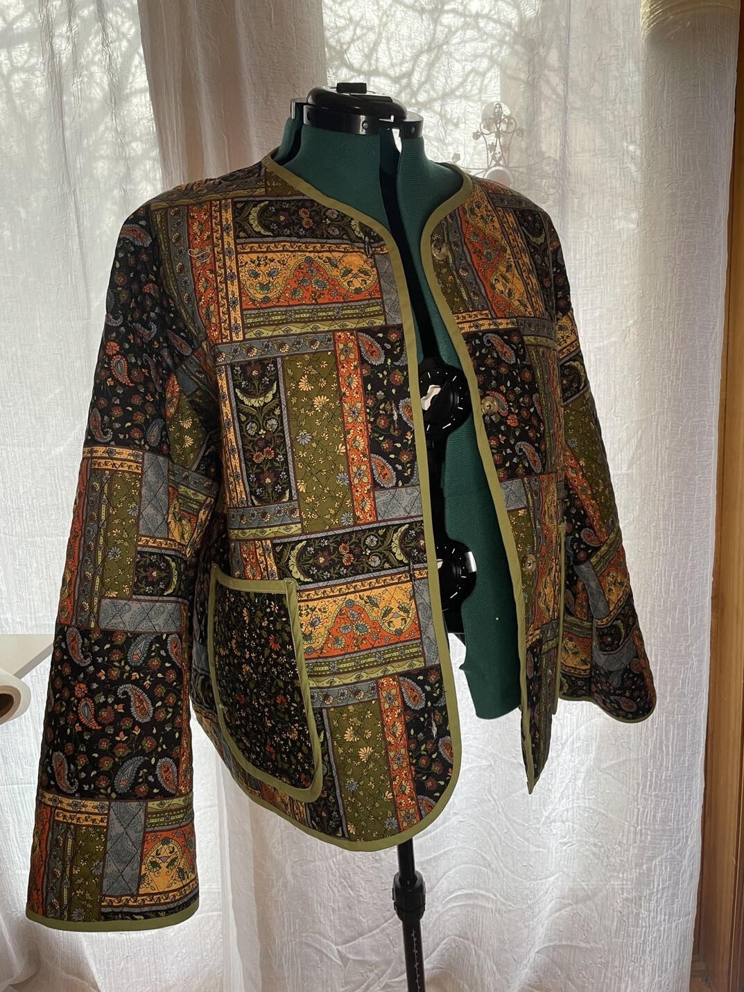 Custom Patchwork Jacket Custom patchwork jacket with detailed patterned panels, pockets, and contrasting trim, sewn by Bee Grace Sewing